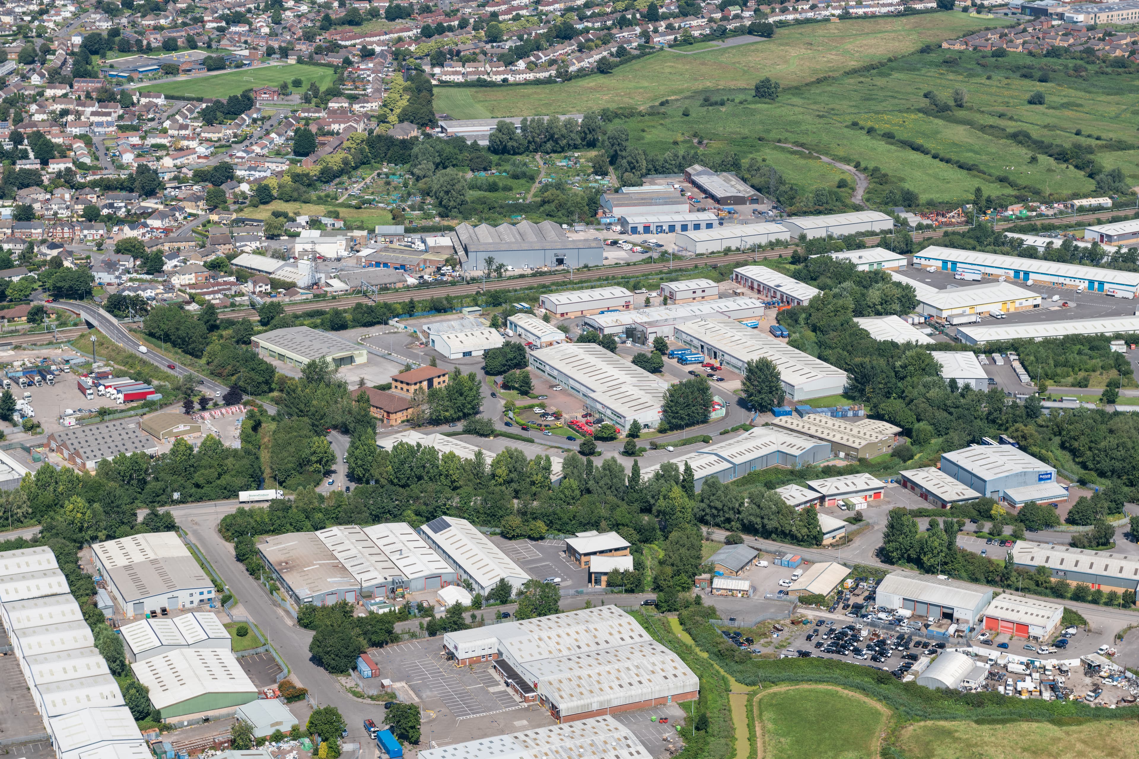 Aerial shot of commercial buildings and green spaces